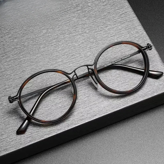 Unisex Round Full Rim Titanium Prescription Glasses 25860 — view 1 | Rx Spectacle