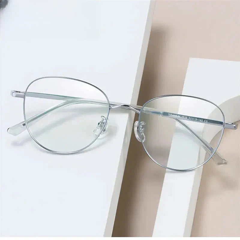 Women's Oval Full Rim Titanium Prescription Glasses 15154 — view 1 | Rx Spectacle