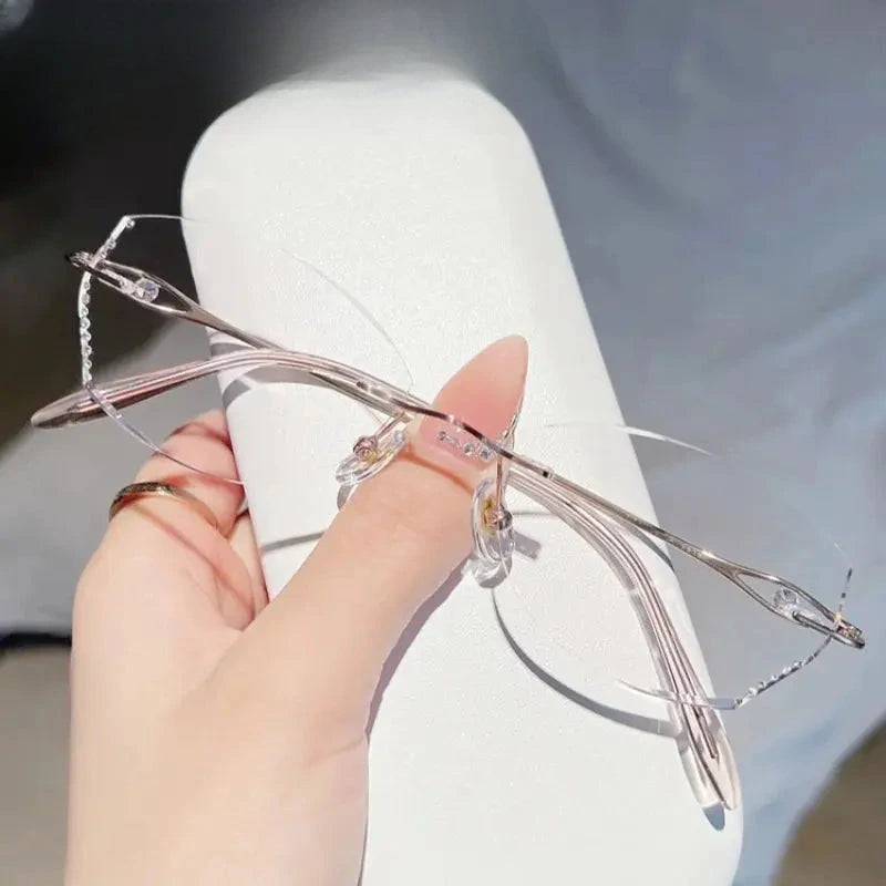 Women's Oval Rimless Titanium Prescription Glasses 698081 — view 1 | Rx Spectacle