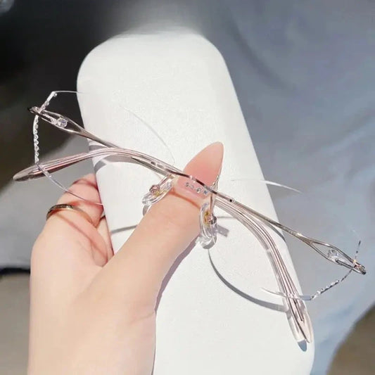 Women's Oval Rimless Titanium Prescription Glasses 698081 — view 1 | Rx Spectacle