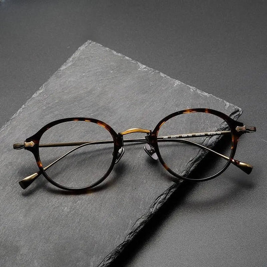 Unisex Round Full Rim Titanium Prescription Glasses Kmn182 — view 1 | Rx Spectacle