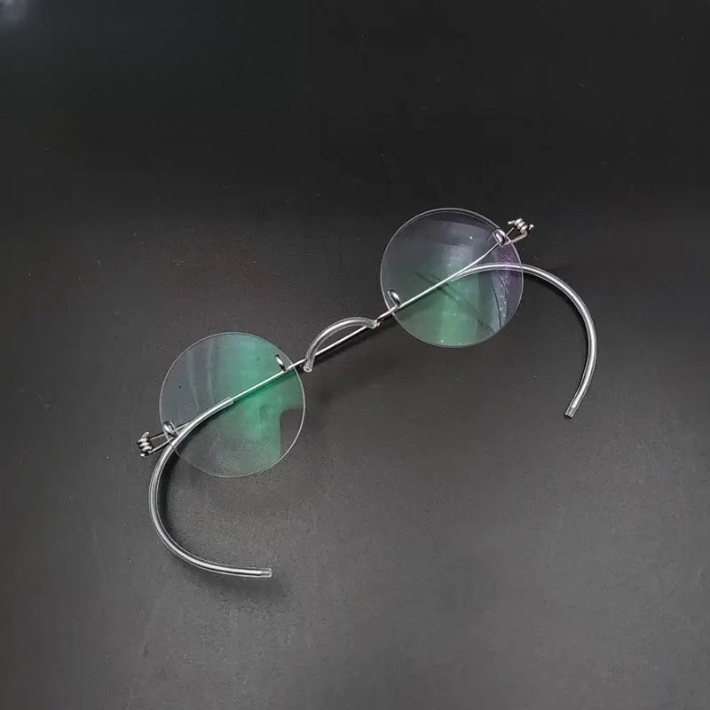 Unisex Round Rimless Stainless Steel Screwless Prescription Glasses 384042 — view 1 | Rx Spectacle