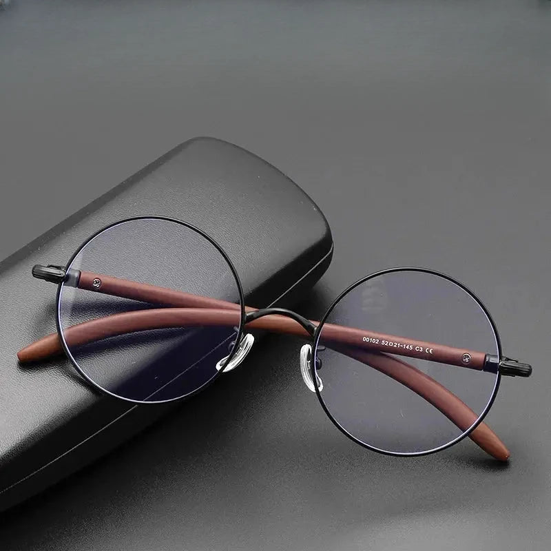 Unisex Round Full Rim Titanium Prescription Glasses 681102 — view 1 | Rx Spectacle
