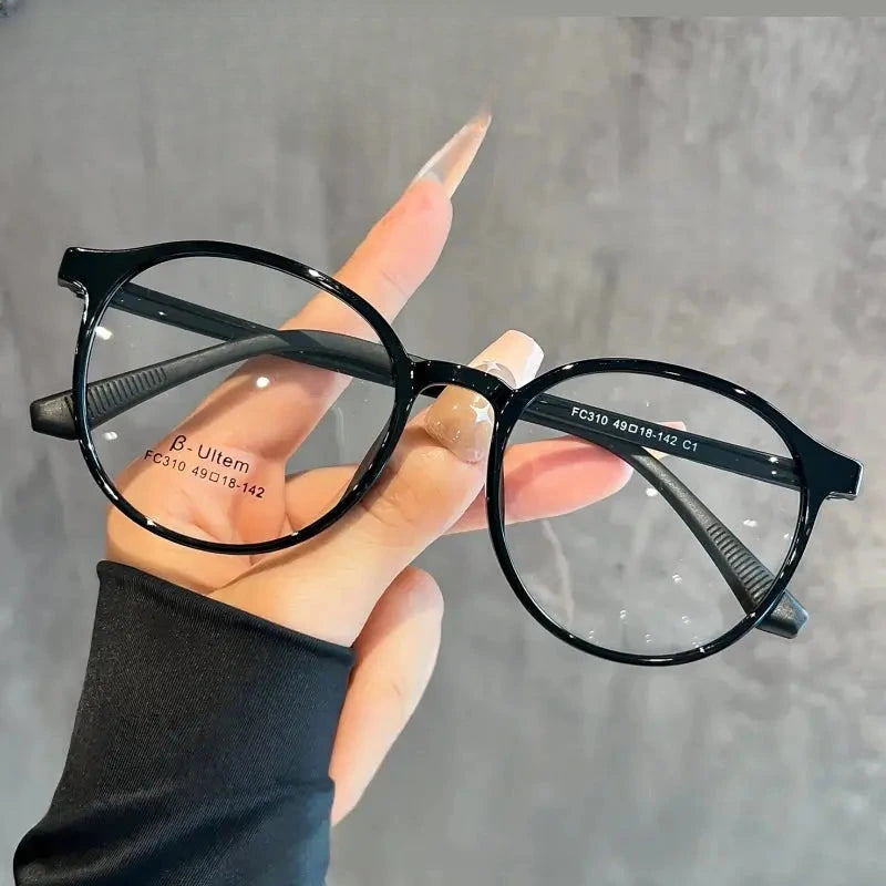 Women's Oval Full Rim Titanium Prescription Glasses 57310 — view 1 | Rx Spectacle