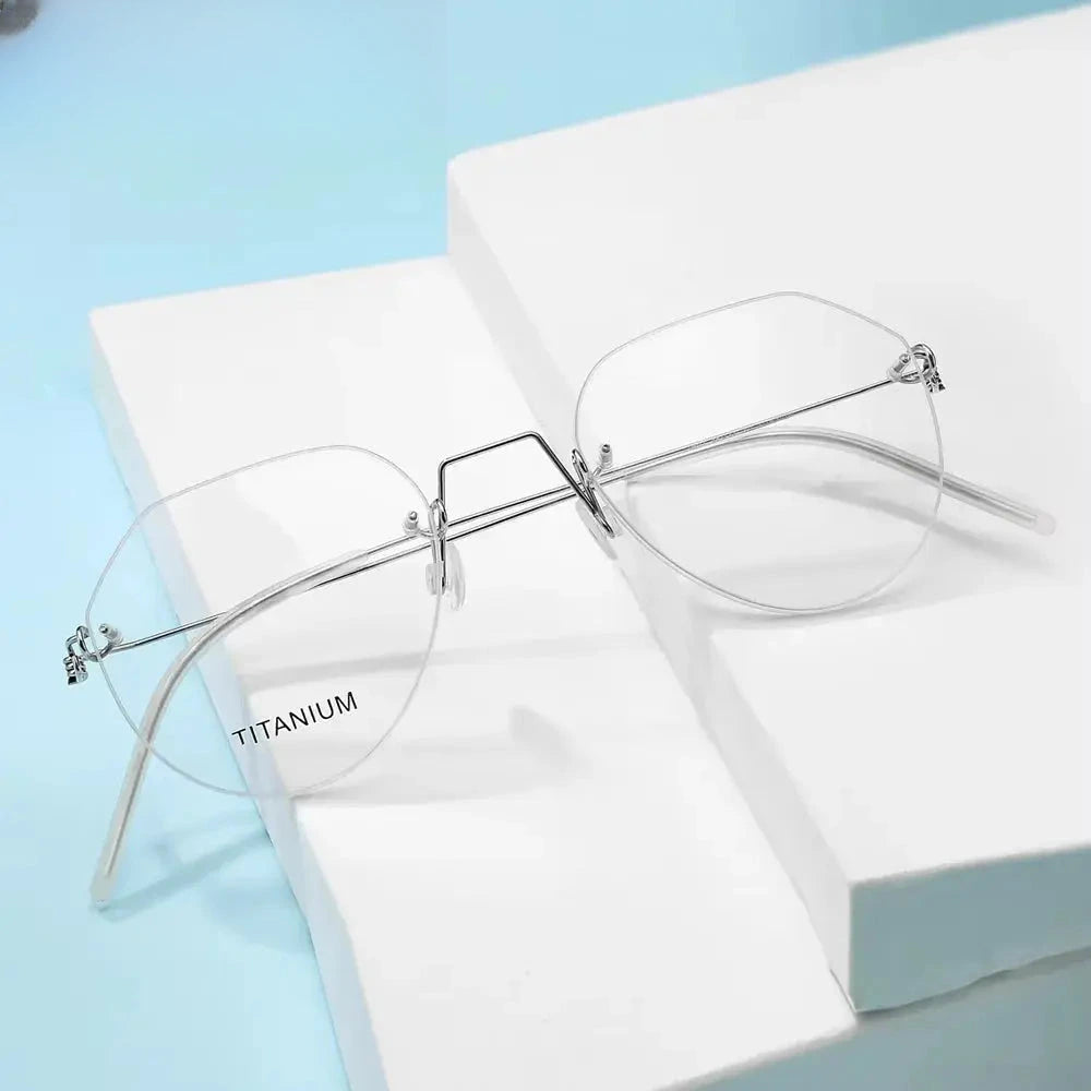 Women's Round Rimless Titanium Flat Top Prescription Glasses 399891 — view 1 | Rx Spectacle