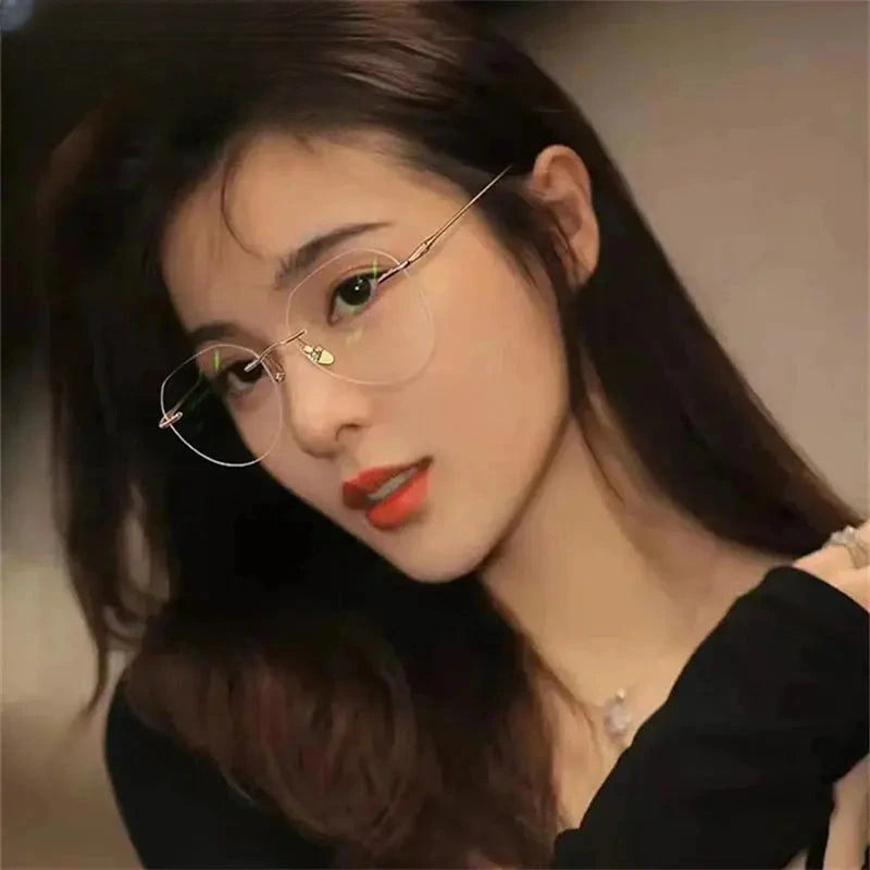 Women's Round Rimless Titanium Flat Top Prescription Glasses 96611 — view 1 | Rx Spectacle