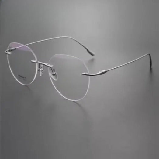 Women's Round Rimless Titanium Flat Top Prescription Glasses 896611 — view 1 | Rx Spectacle