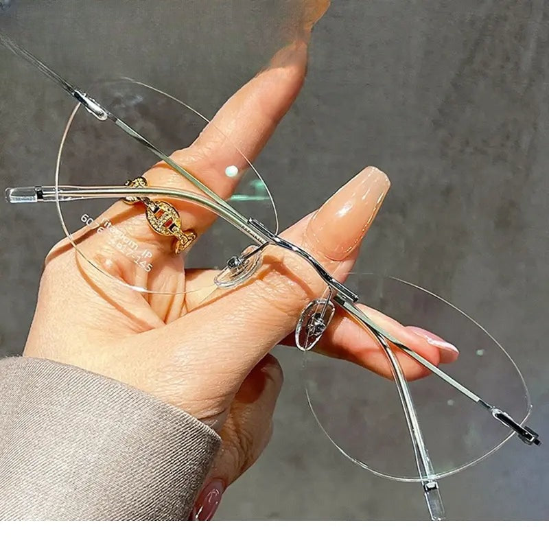 Women's Cat Eye Rimless Titanium Prescription Glasses 366076 — view 1 | Rx Spectacle