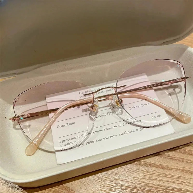 Women's Cat Eye Rimless Titanium Prescription Glasses 88057 — view 1 | Rx Spectacle