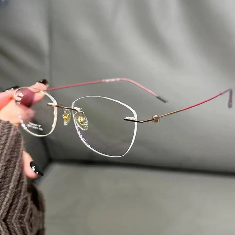 Women's Cat Eye Rimless Titanium Prescription Glasses 666071 — view 1 | Rx Spectacle