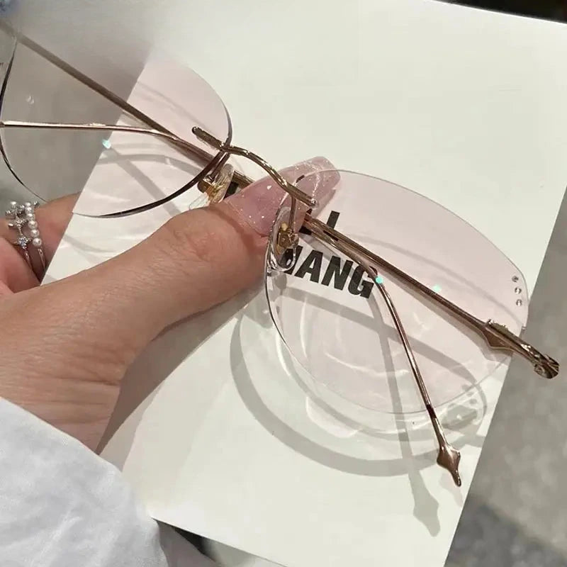 Women's Butterfly Rimless Titanium Prescription Glasses 699560 — view 1 | Rx Spectacle