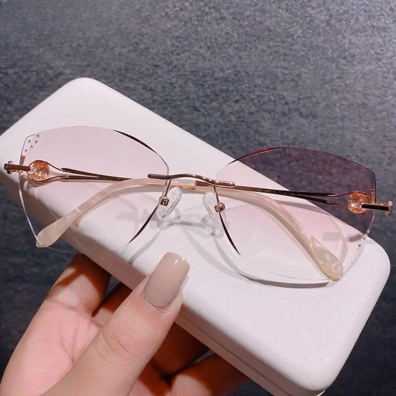 Women's Cat Eye Rimless Titanium Prescription Glasses 98101 — view 1 | Rx Spectacle