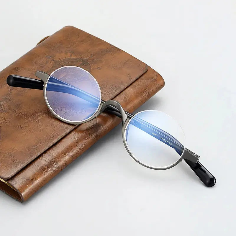 Unisex Round Semi-Rimless Titanium Prescription Glasses N80 — view 1 | Rx Spectacle