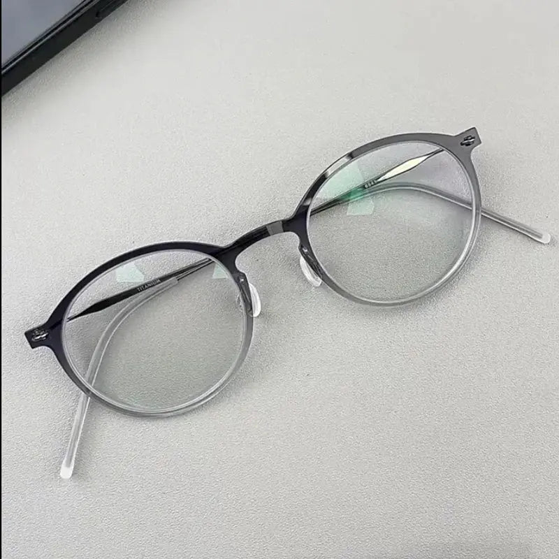 Unisex Round Full Rim Titanium Prescription Glasses 16541 — view 1 | Rx Spectacle