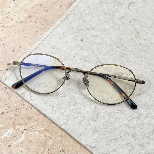 Women's Oval Full Rim Titanium Prescription Glasses 27501 — view 1 | Rx Spectacle