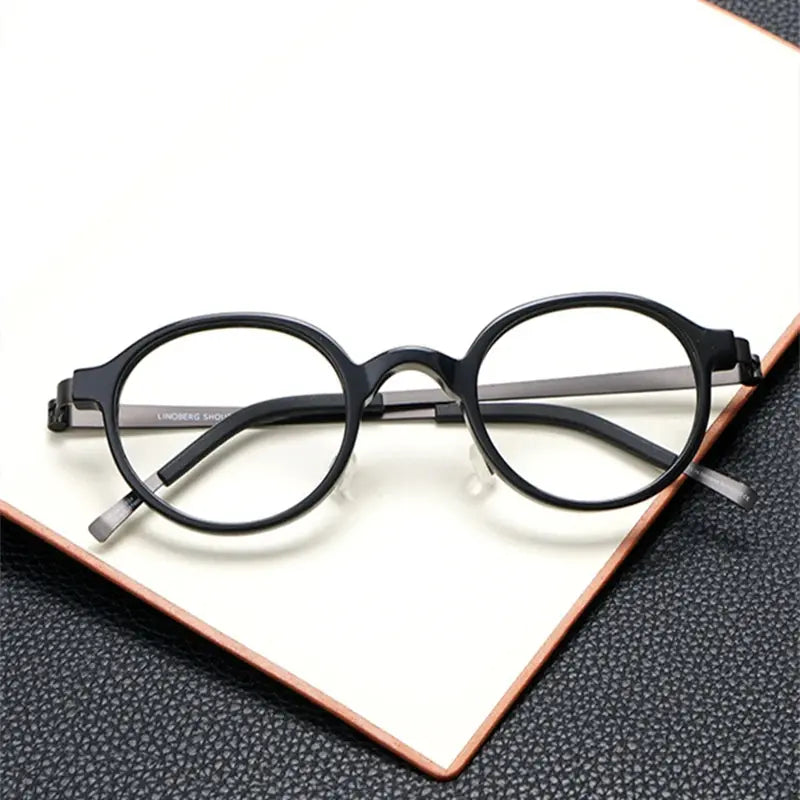 Unisex Round Full Rim Titanium Screwless Prescription Glasses 49101 — view 1 | Rx Spectacle