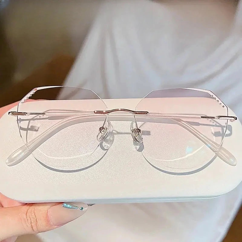 Women's Oval Rimless Titanium Prescription Glasses 666085 — view 1 | Rx Spectacle