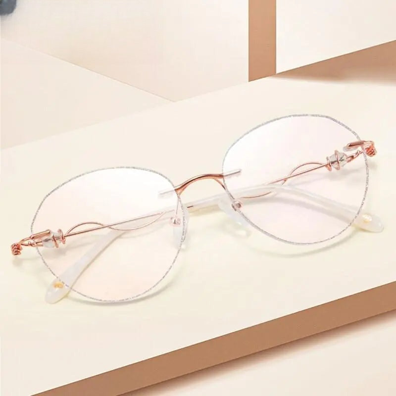 Women's Round Rimless Titanium Prescription Glasses 88128 — view 1 | Rx Spectacle