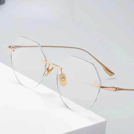 Women's Round Rimless Titanium Flat Top Prescription Glasses 73536 — view 1 | Rx Spectacle