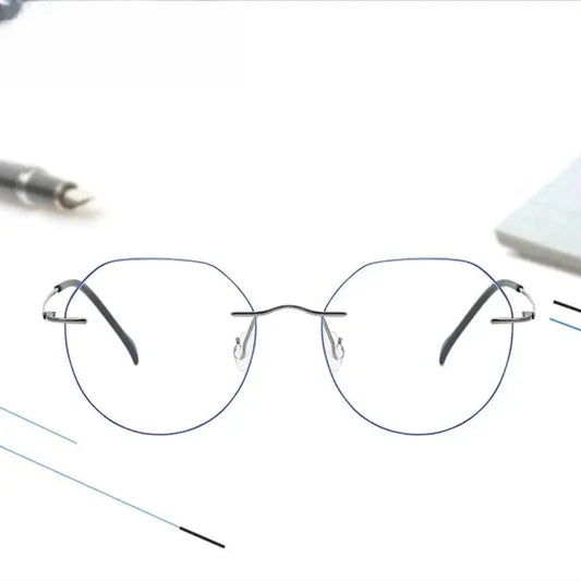 Women's Round Rimless Titanium Flat Top Prescription Glasses 778408 — view 1 | Rx Spectacle