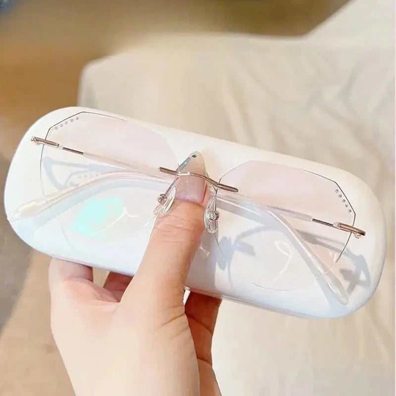 Women's Oval Rimless Titanium Prescription Glasses 666085 — view 3 | Rx Spectacle