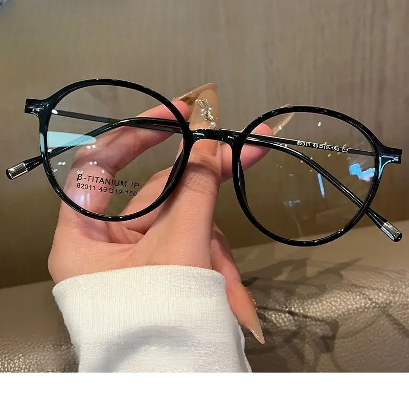 Women's Oval Full Rim Titanium Prescription Glasses 82011 — view 1 | Rx Spectacle