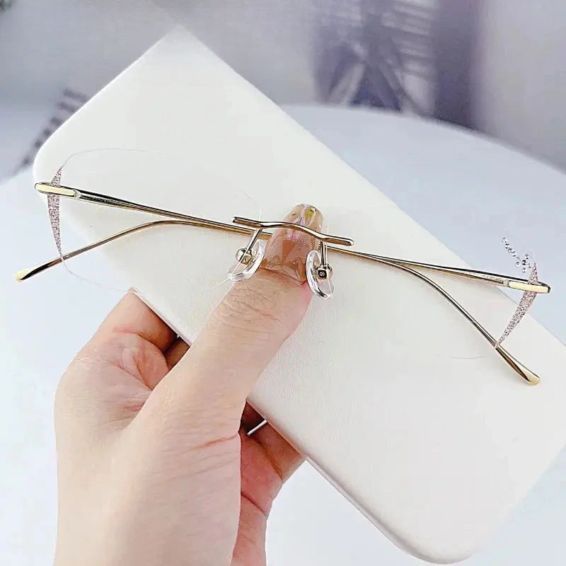 Women's Oval Rimless Titanium Prescription Glasses 698989 — view 2 | Rx Spectacle