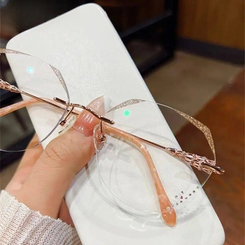 Women's Round Rimless Titanium Prescription Glasses 156 — view 2 | Rx Spectacle