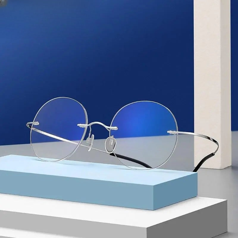Unisex Round Rimless Titanium Prescription Glasses 6074 — view 1 | Rx Spectacle