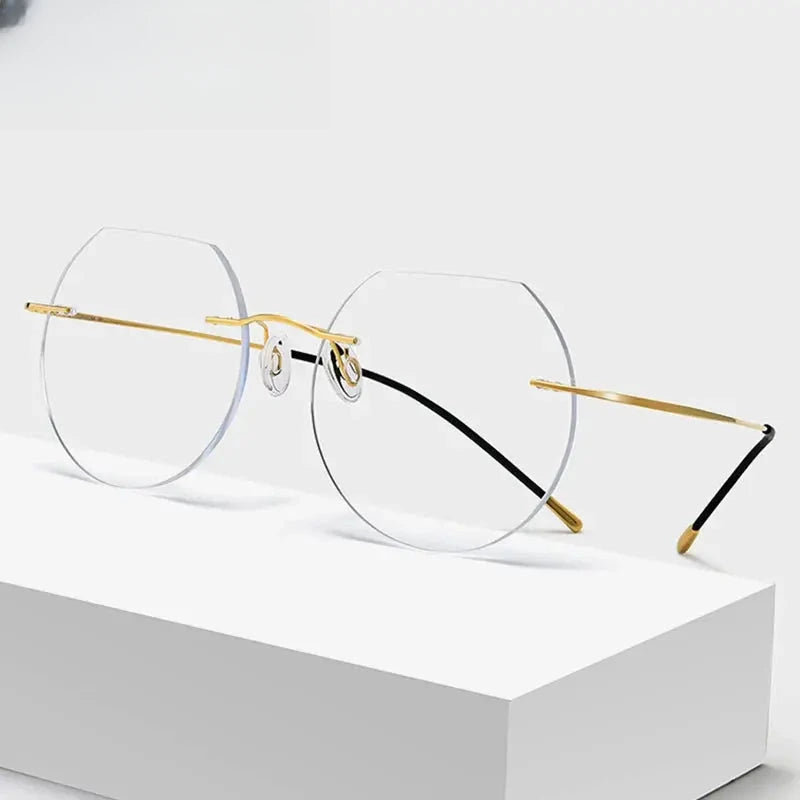 Women's Round Rimless Titanium Flat Top Prescription Glasses 70120 — view 1 | Rx Spectacle