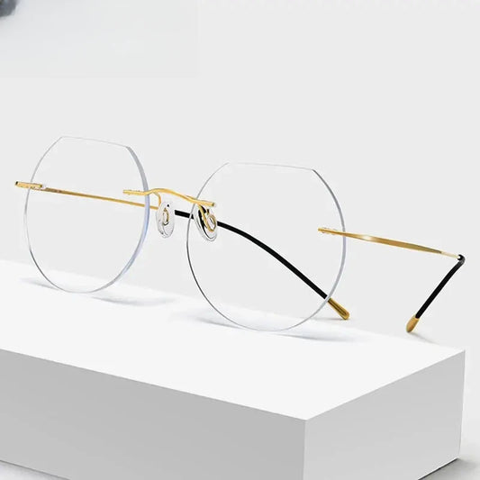 Women's Round Rimless Titanium Flat Top Prescription Glasses 70120 — view 1 | Rx Spectacle